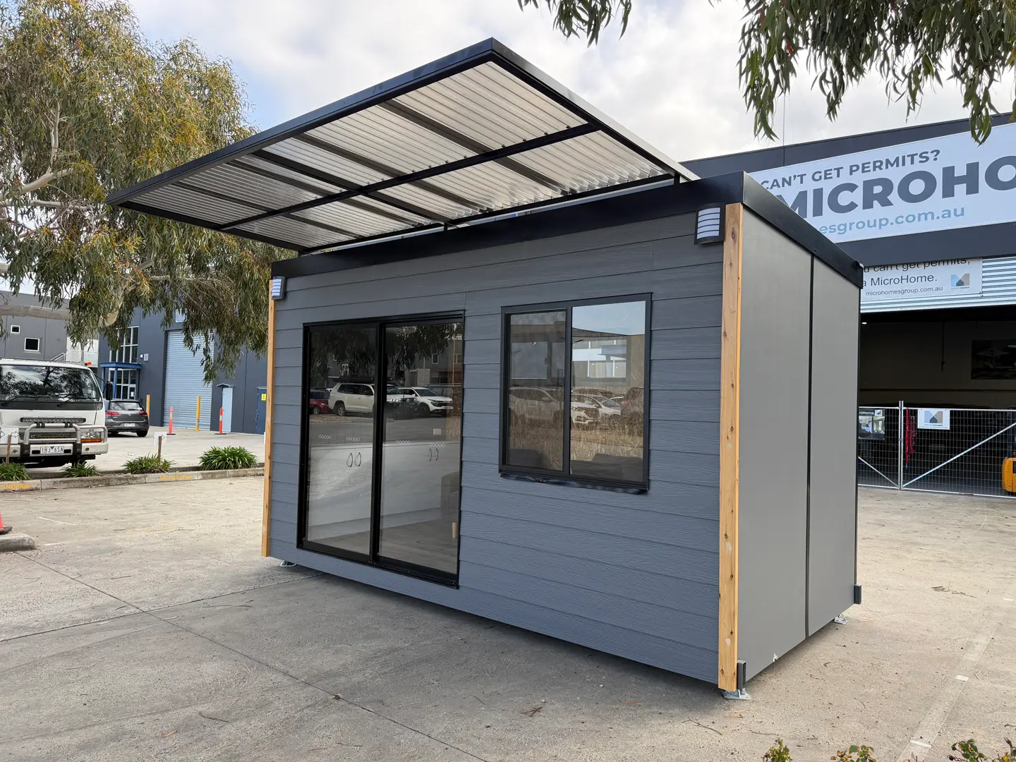 The ex-demo Backyard Pod seen from the right, with its sliding glass door and timber corner post.