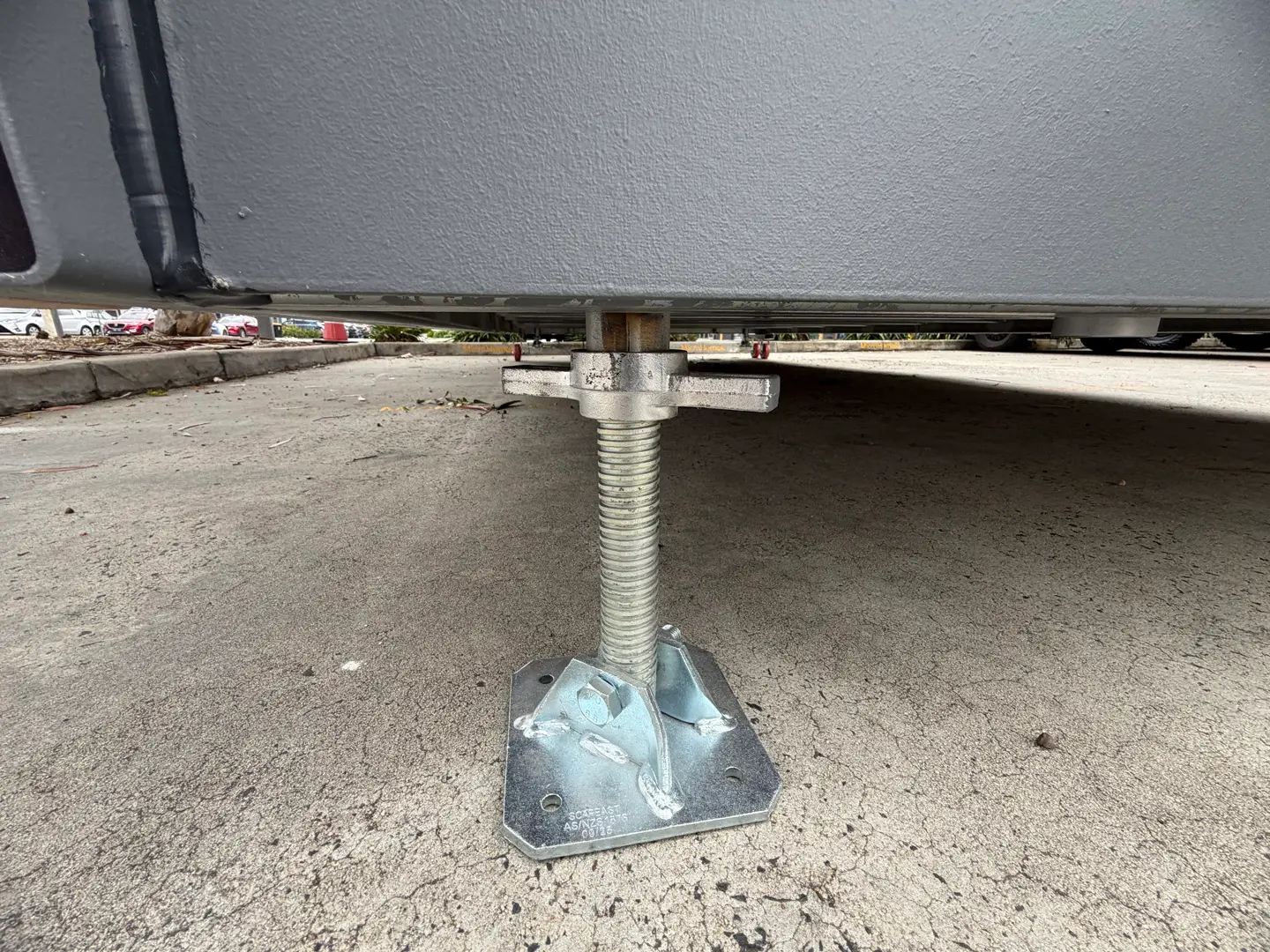 One of the adjustable steel footing legs under the ex-demo Backyard Pod.