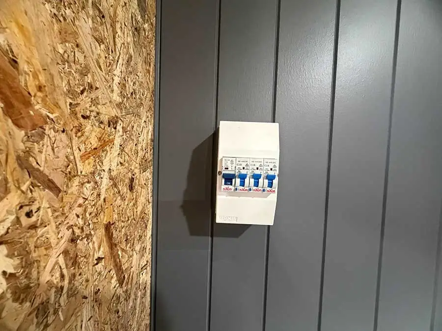 The switchboard and safety switches installed on the external wall of a Backyard Pod.